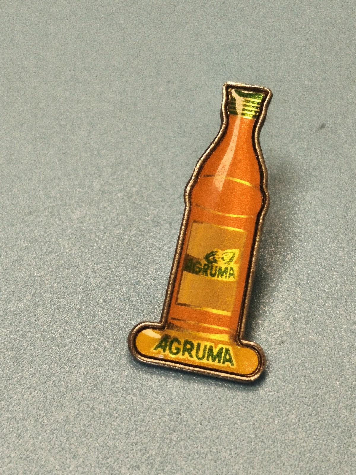 Pin's vintage AGRUMA bouteille orange boisson publicitaire collection rétro