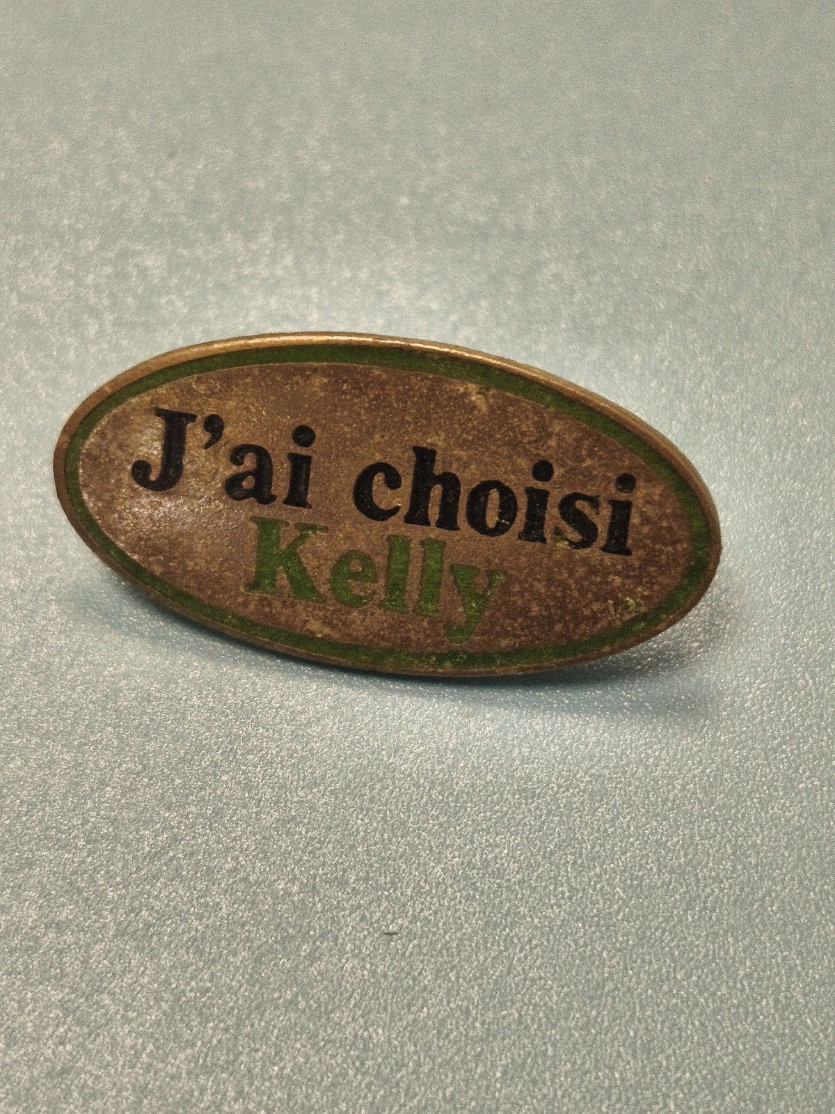 Vintage pin's ovale "J'ai choisi Kelly" vert, collection publicitaire ancien