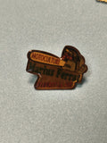 Pin's vintage Marius Ferrat moticulture, forme tronçonneuse, collection publicit