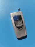 Ancien briquet publicitaire forme téléphone portable vintage, argenté, à tester