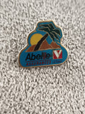 Pin's vintage Abeille Assurances logo Rouge Victoire palmier soleil