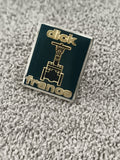 Pin's vintage Dick France émaillé noir or, logo industriel, badge publicitaire a