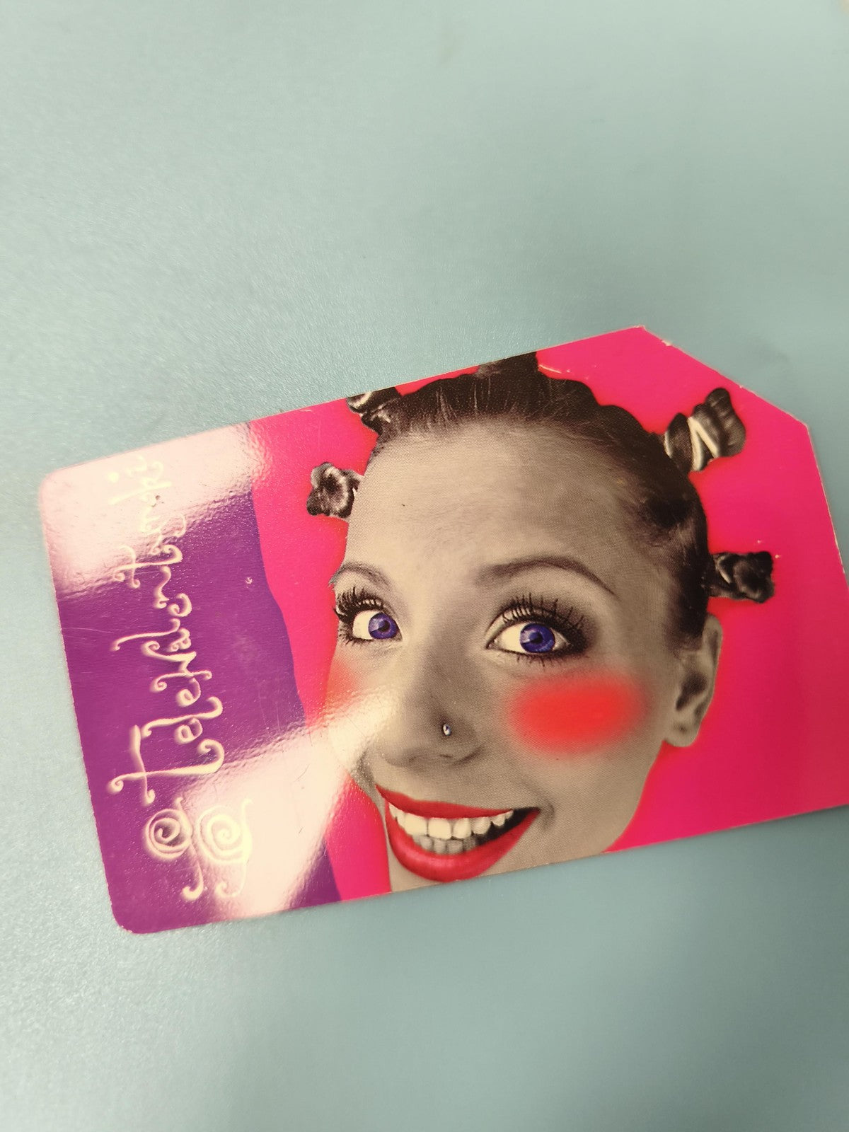 Ancienne télécarte étrangère Satelitalneg visage pop art coloré collection