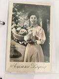 Carte postale ancienne Joyeuses Pâques femme panier fleurs DML début XXe