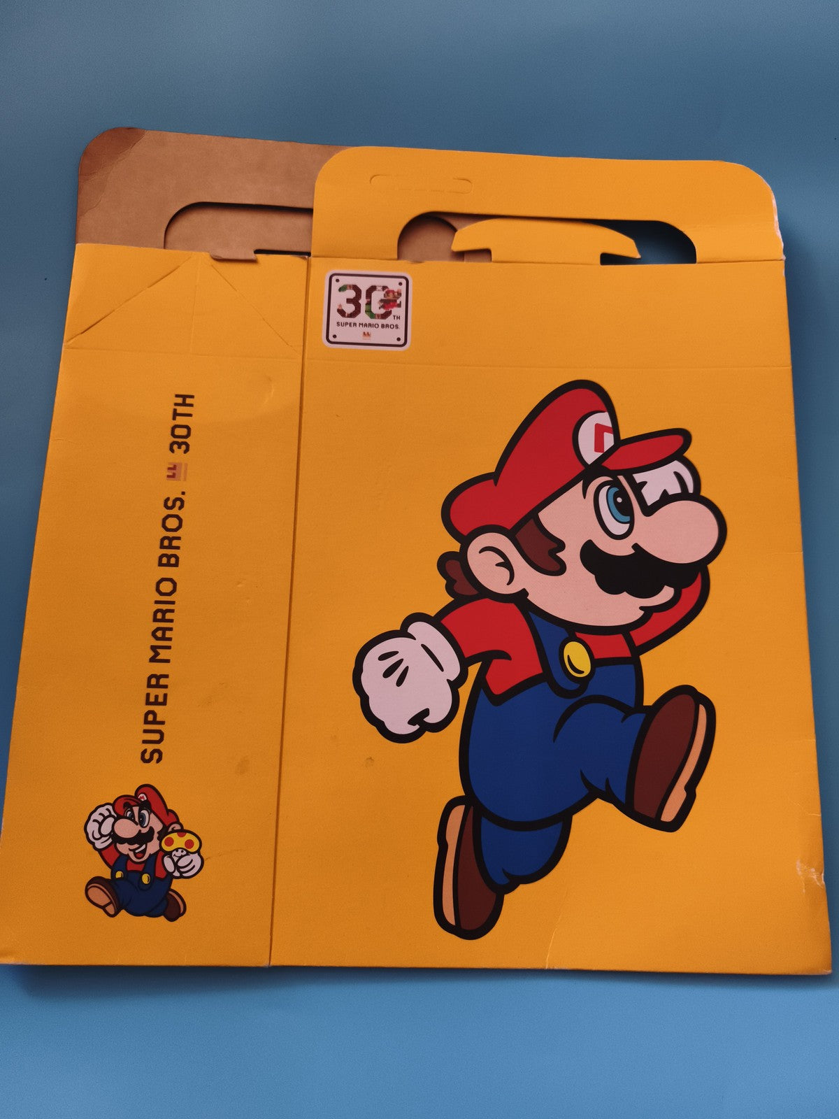 Pochette Super Mario Bros 30th anniversaire Nintendo carton jaune