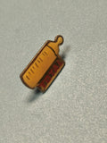 Pin's vintage TOTAL biberon jaune, collection publicitaire ancien ref 10