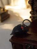 Porte-clés vintage casque Napoléon noir publicité vin champagne