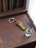 Porte-clés vintage GRAMONT métal, publicité fromage, rectangulaire illustré