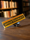 Autocollant ancien amortisseurs jaune noir vintage auto moto rétro publicité