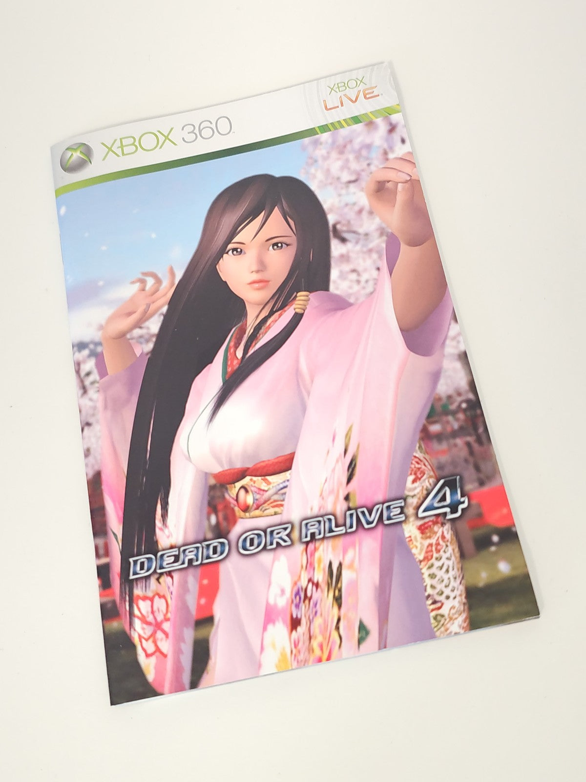 Notice officielle Xbox 360 Dead or Alive 4 - Manuel seul, version française d'or