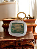 Porte-clés publicitaire vintage France climatiseur doré, design rétro