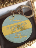 Porte-clés publicitaire vintage Cassis L'Héritier Guyot Dijon France rétro
