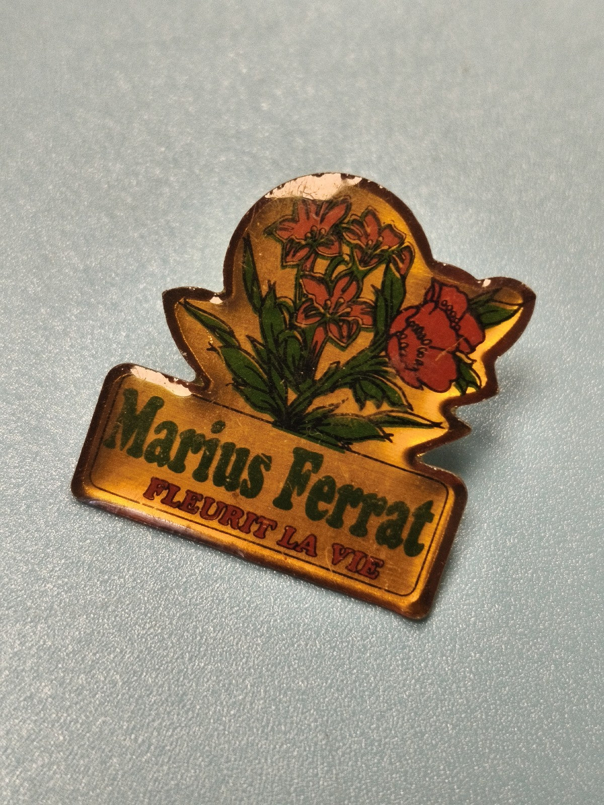 Vintage pin's Marius Ferrat fleurs publicitaire ancien collection (Ref 4)