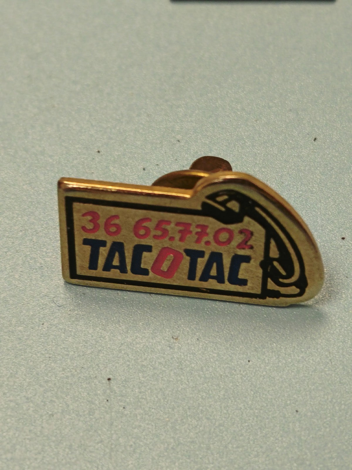 Pin's vintage TACO TAC téléphone publicitaire ancien, inscription 36 65 77 02