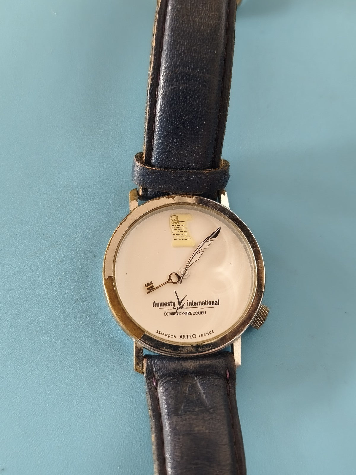 Montre vintage Amnesty International publicitaire ancienne, collector rétro rare
