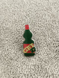 Pin's vintage bouteille GET 27 vert rouge, badge ancien pub apéritif (Ref 1)