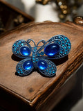 Broche papillon vintage bleue strass cabochons, bijou rétro élégant