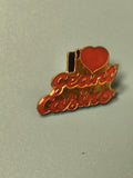 Vintage pin's Géant Casino rouge doré collection publicitaire ancien