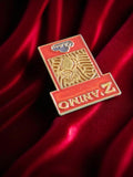 Pin's publicitaire vintage Z Animo Cadbury rouge doré rare