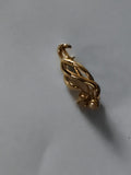 Broche vintage dorée, bijou fantaisie, motif torsadé élégant