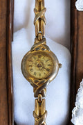 Montre femme Fontenay vintage dorée cadran romain bracelet motif tressé