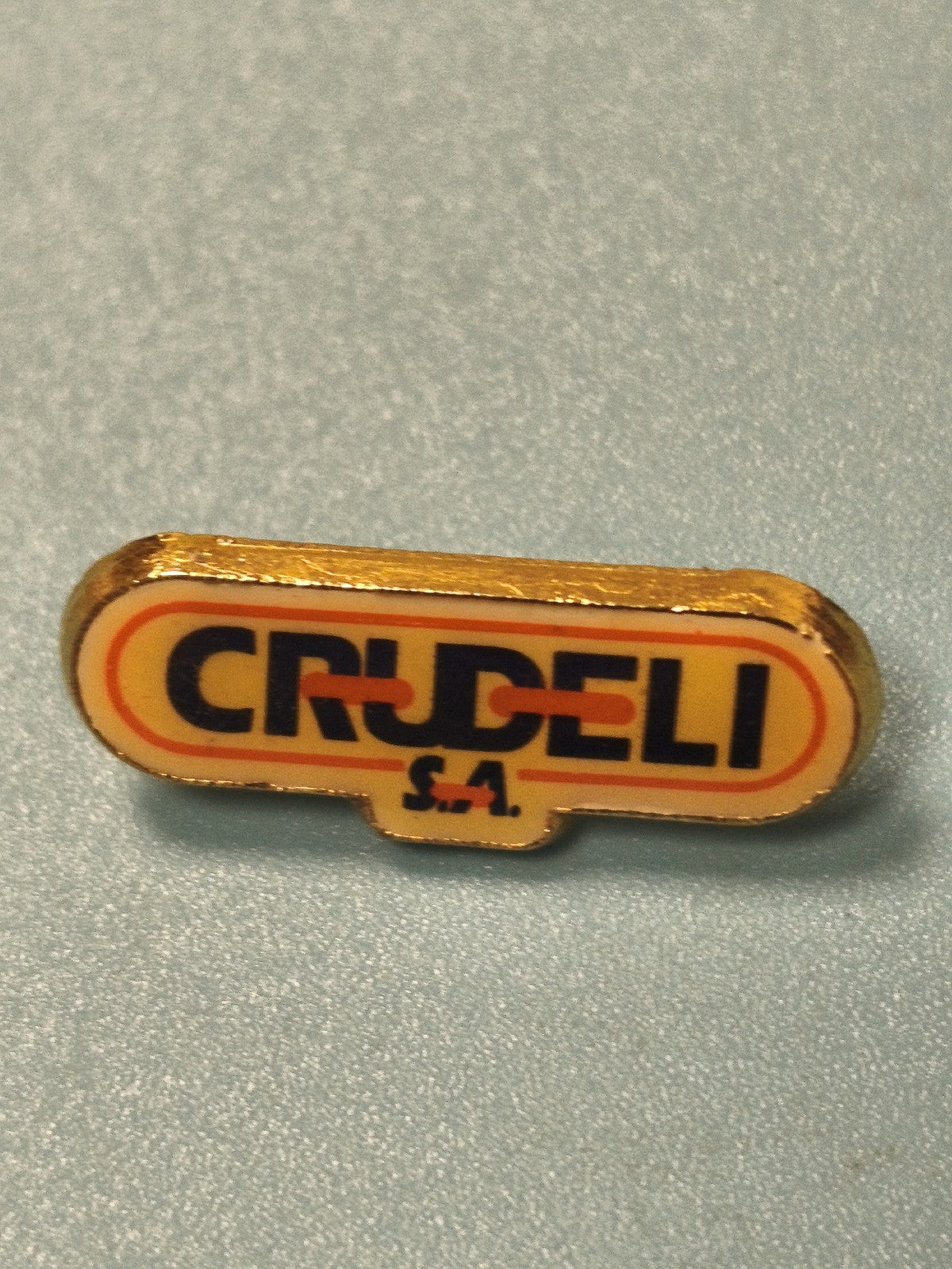 Vintage pin's publicitaire Crudeli S.A. jaune orange années 80 collection