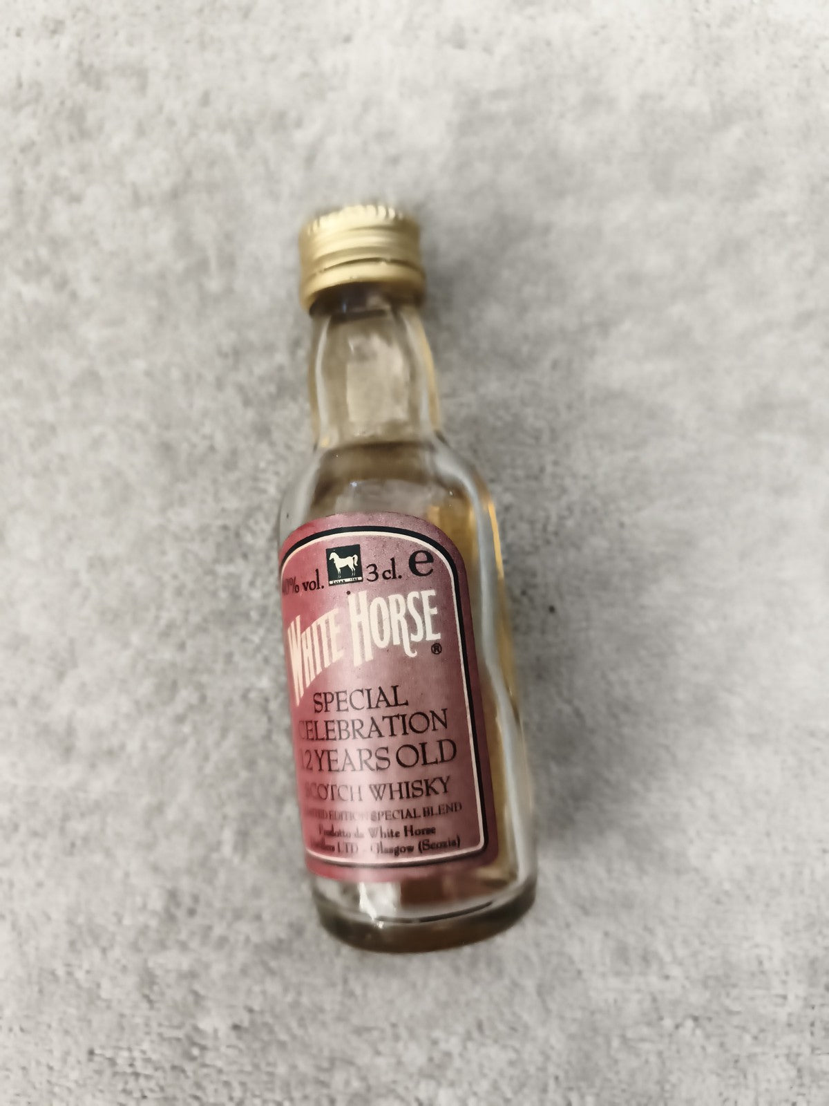 Miniature whisky White Horse 12 years old étiquette rouge 3 cl partiellement rem