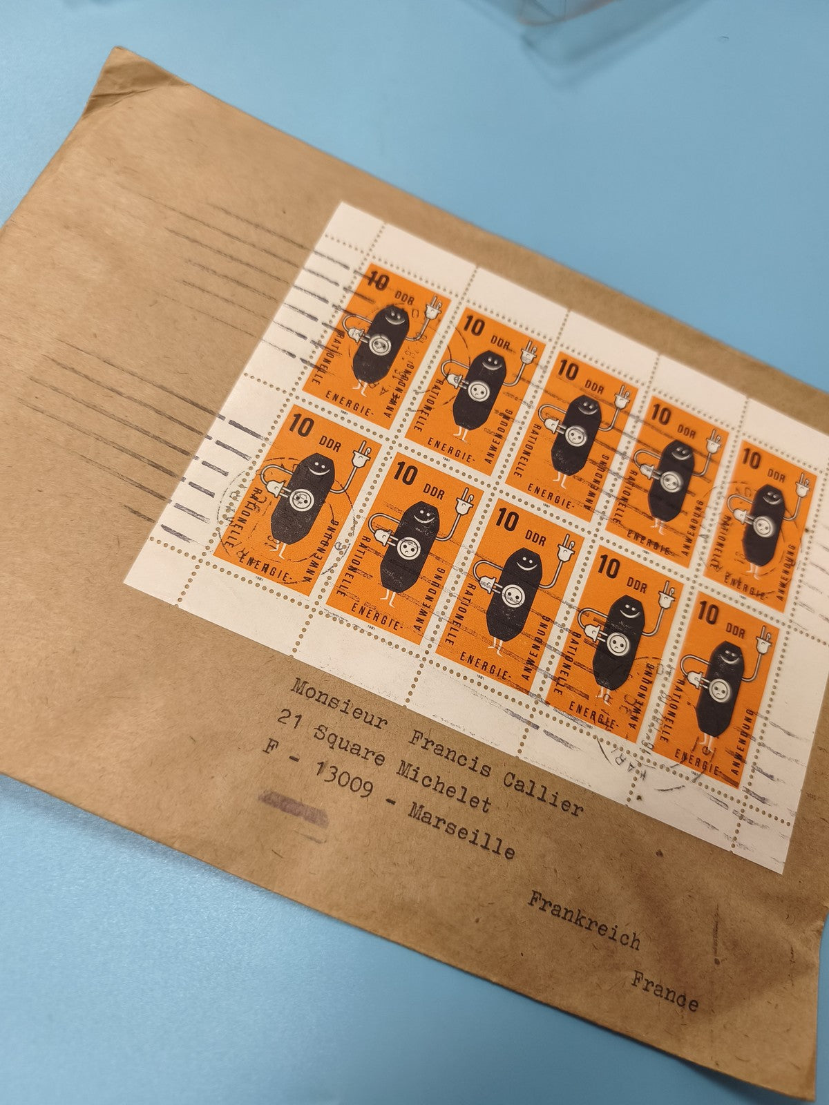 Ancienne enveloppe DDR timbres oblitérés énergie mascotte orange collection phil