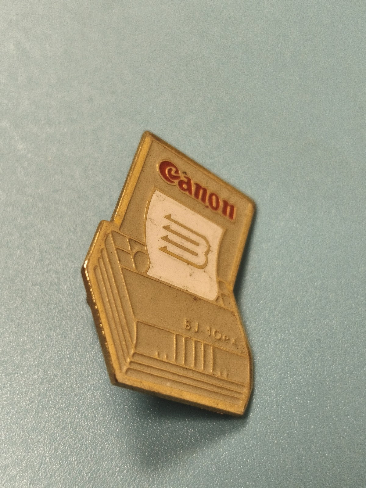 Vintage pin's Canon imprimante BJ 10e, émail beige et doré, collection