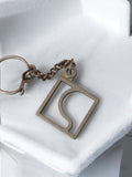 Porte-clés vintage ancien carré design rétro accessoire publicitaire métal