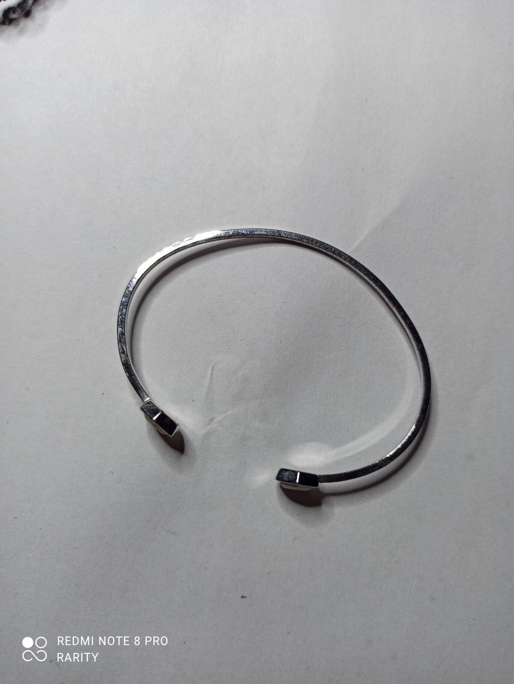 Bracelet jonc femme Cluse finition argentée extrémités hexagonales