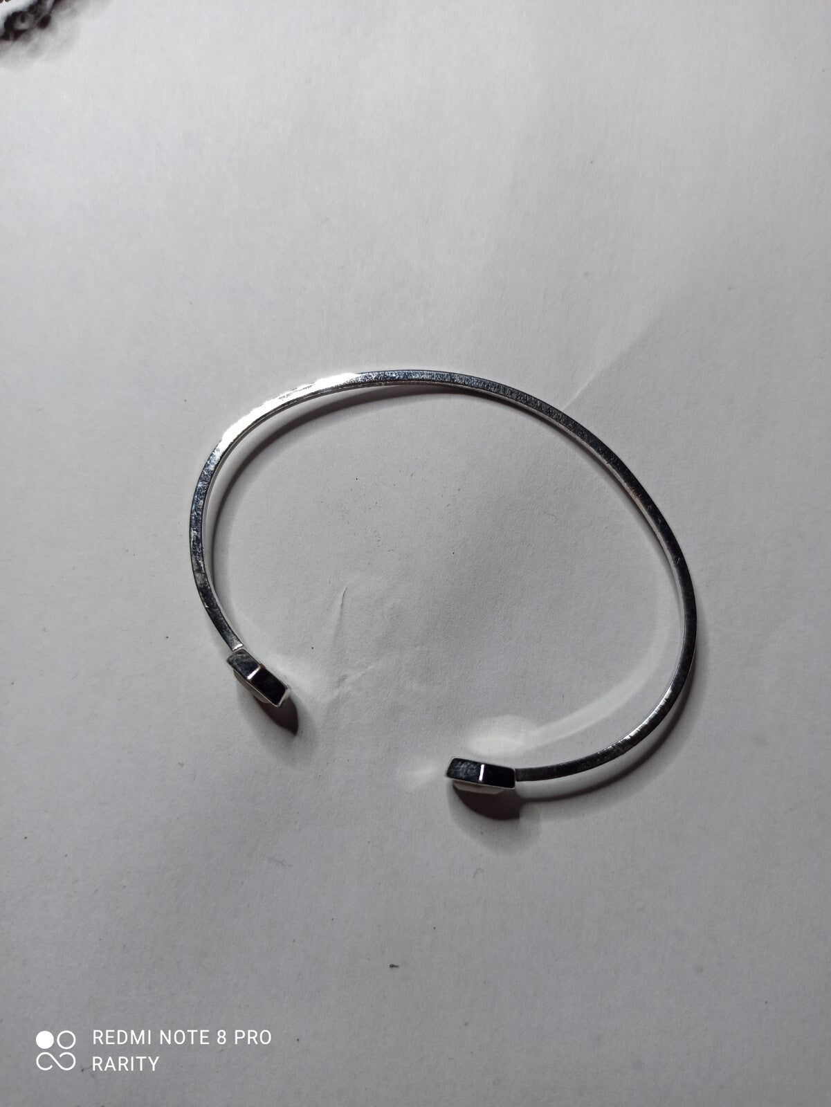 Bracelet jonc femme Cluse finition argentée extrémités hexagonales