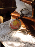 Porte-clés publicitaire Loste vintage lion rond ancien rétro pub France