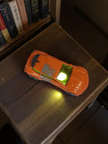 Voiture miniature Majorette vintage orange rétro, modèle ancien, éclairage jaune