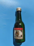 Mignonnette vintage Marett Cognac VSOP, bouteille verte ancienne, mi pleine