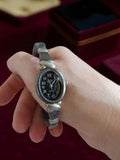Montre vintage femme Giovani Beverly Hills, bracelet rigide rétro, cadran noir