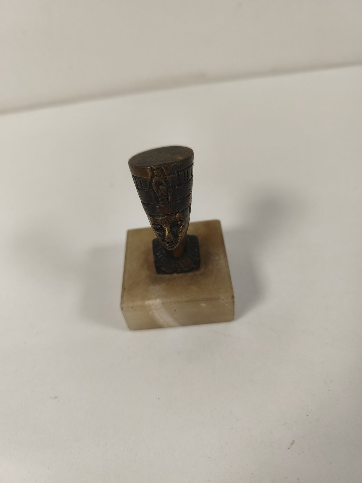 Old Egyptian head statuette on base, vintage decor style