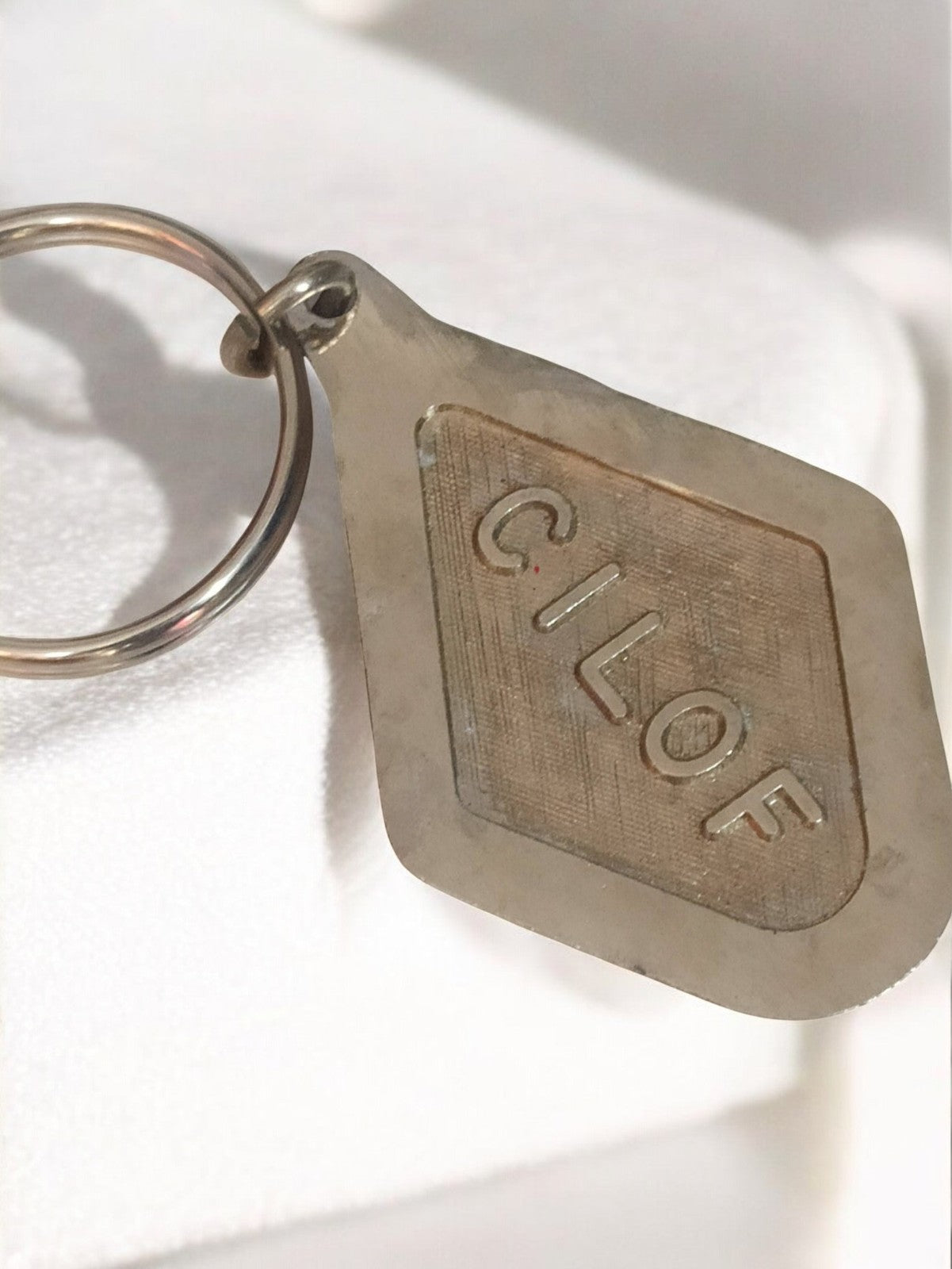 Porte-clés publicitaire ancien CILOF vintage métal aspect argenté rétro
