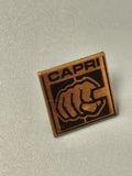 Vintage pin's CAPRI carré logo poing noir doré collection rétro (Ref 12)