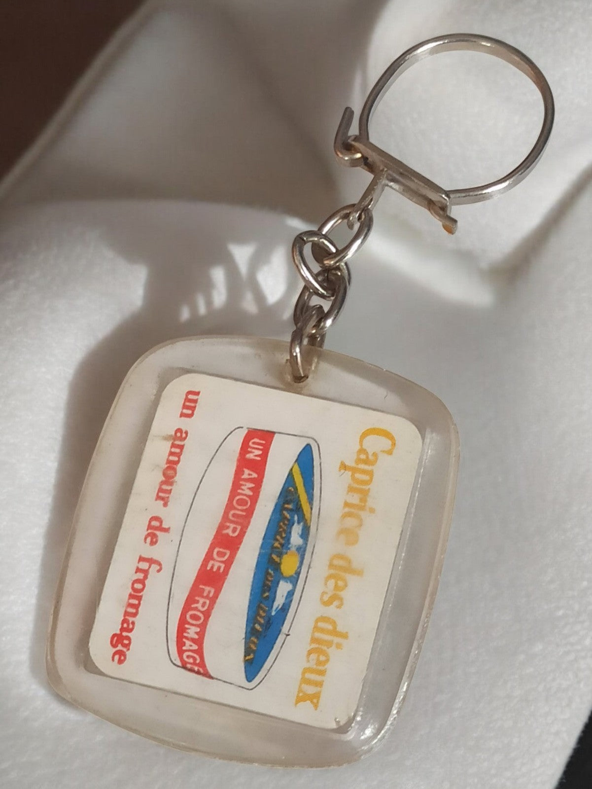 Porte-clés publicitaire vintage Caprice des Dieux rétro, fromage ancien